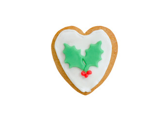 christmas gingerbread heart with red berries isolated