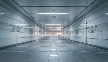 Perspective of Empty underground passage at night