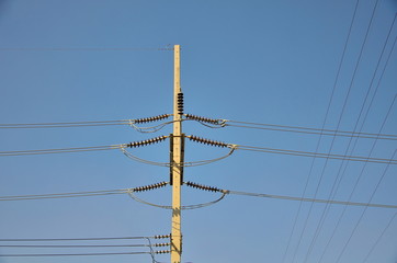 voltage electricity pole with blue clear sky background
