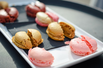 Colorful tasty macaroons in a row