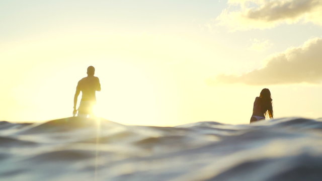 Slow Motion Silhouette Happy Couple Stand Up Paddling Boarding In Ocean 