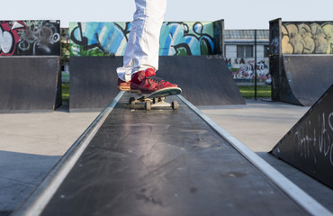 Close up of skateboarder at skate park