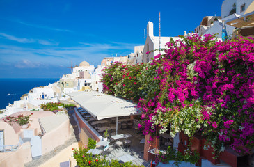 SANTORINI, GREECE - OCTOBER 5, 2015: The Oia and Therasia island in the background.