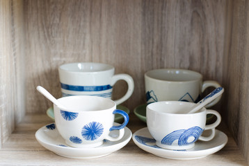 Porcelain cup on wooden background
