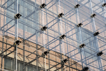 building with brick wall under construction