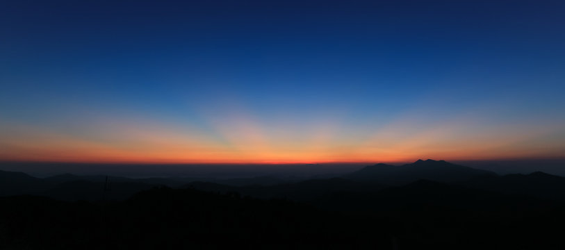 Fototapeta Panorama of colorful sky above mountain just before sunrise