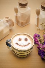 Fototapeta na wymiar hot coffee with foam milk art smile pattern