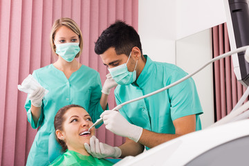 Portrait of dentist and patient at dental clinic