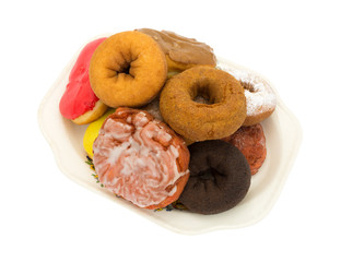 Several donuts and fritter on an old platter
