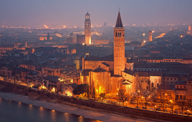 Fototapeta na wymiar Verona - Outlook from Castel san Pietro in winter evening to Santa Anastasia church