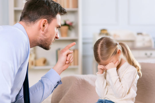 Strict Father Punishing His Daughter 