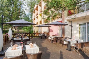 terrace restaurant in the park, with a table setting