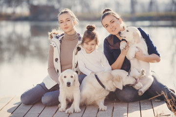 Happy family with Pets near the lake