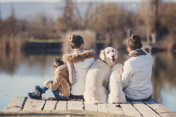 Happy family with Pets near the lake