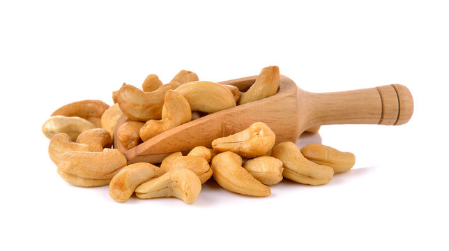 Cashews in the scoop on white background