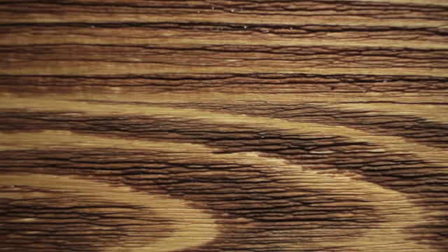 Wood painting with a brush with the brown color