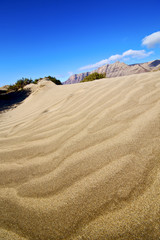 abstract yellow dune beach  hil and mountain    lanzarote spain
