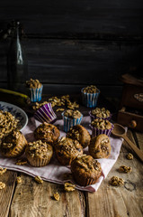 Obraz na płótnie Canvas Whole grain muffins with dark chocolate and nuts