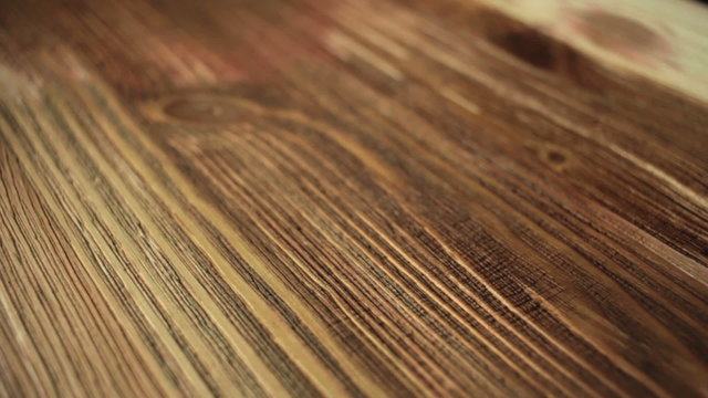 Paint brush painting  wooden table with wood stain
