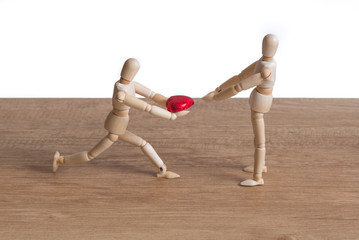 A wooden doll man in a valentine theme show his love to his couple and ask for love