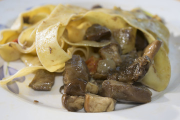 pappardelle with edible boletus and cherry tomatoes