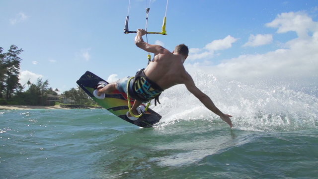 Young Man Kite Surfing In Ocean, Extreme Summer Sport