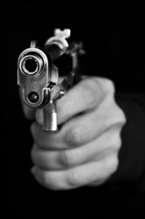 Man holding metal gun