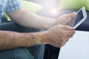 Man networking on tablet