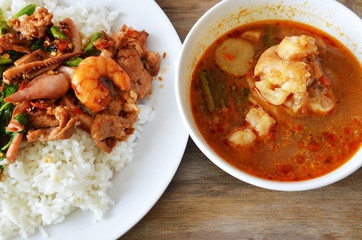 spicy stir-fried seafood with basil leaf and pork knuckle soup