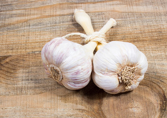 Fresh garlic on board closeup.