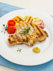 Juicy grilled pork chop with onion