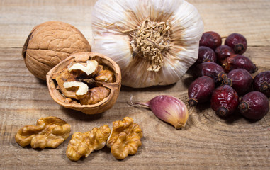 Dried fruit of hawthorn, garlic and walnuts. The concept of alternative medicine.