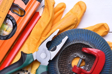 Set of construction tools on wooden background