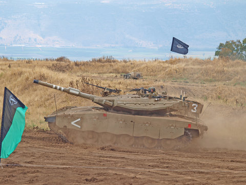 Merkava tanks and Israeli soldiers in training armored forces