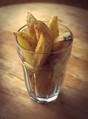 Cup of hot fried potato slices vegetarian snack food