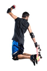 Man with skateboard jumping