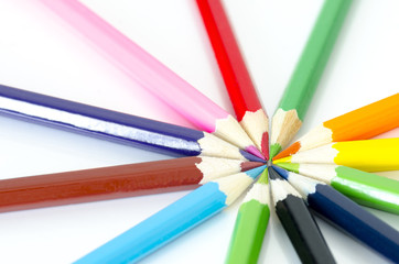 Many different colored pencils on white