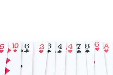 Fototapeta na wymiar Playing cards with different numbers and colors in line isolated