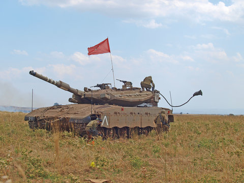Merkava tanks and Israeli soldiers in training armored forces