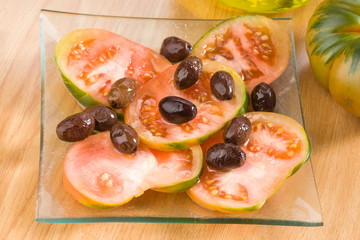 Homemade tomato salad with black olives