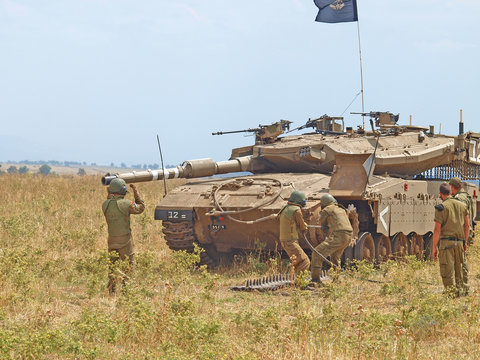 Merkava tanks and Israeli soldiers in training armored forces