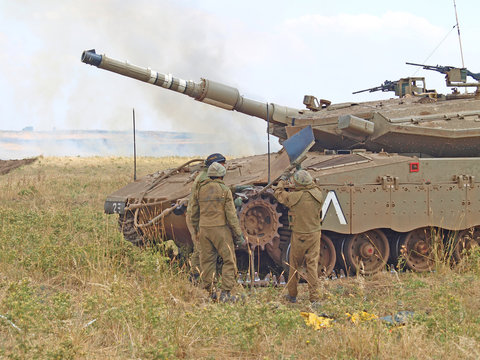 Merkava tanks and Israeli soldiers in training armored forces