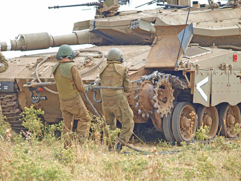 Merkava tanks and Israeli soldiers in training armored forces