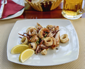 Fried squid stuffed with vegetables. Sea food