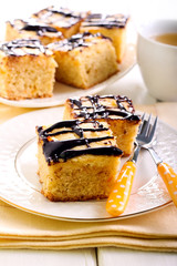 Cream and chocolate glaze topping blondie