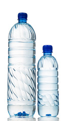Big and small refreshing natural mineral water in plastic bottle in white background
