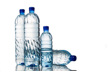 Four refreshing natural mineral water in plastic bottle in white background