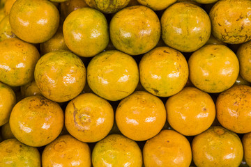 Fresh Thai honeysuckle oranges pile texture