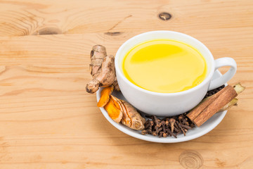 Aromatic milk tea with ginger roots, cinnamon, cloves and black pepper offers many wellness health benefits