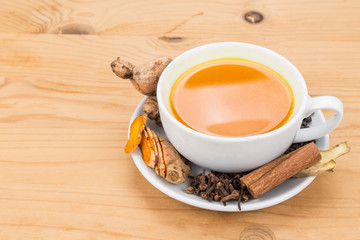Aromatic turmeric tea with black pepper, cinnamon, cloves and ginger offers many wellness health benefits